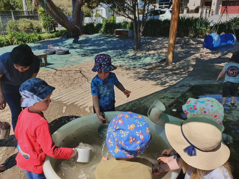 Children engaged in water play at the centre